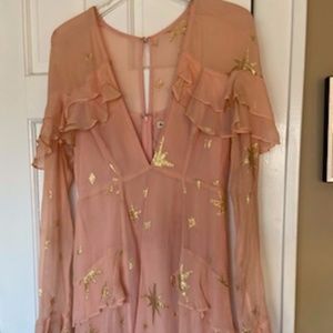 Super fun party top with gold accents that shine